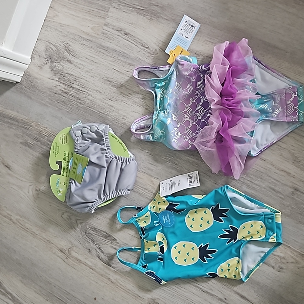 2 swimsuits and 6 month swim diaper